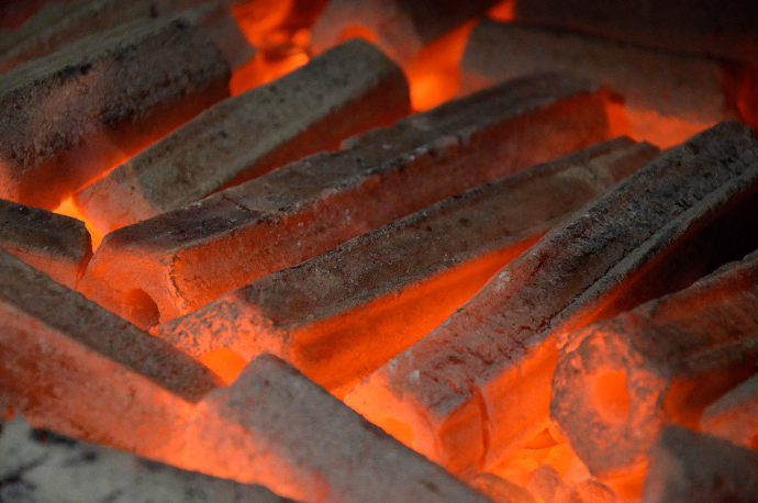 sawdust briquettes burning 